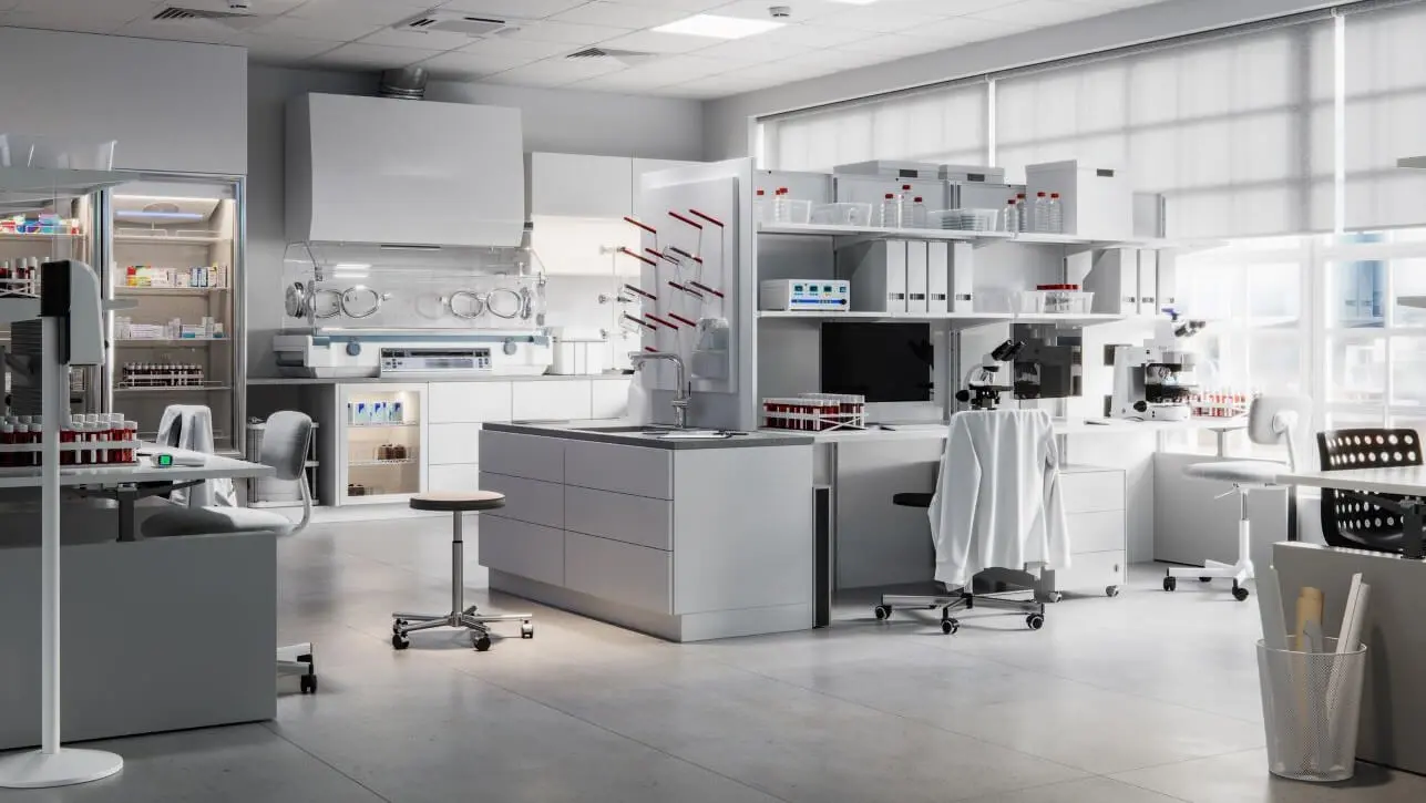 Image of an empty science laboratory featuring work stations, chairs and various lab equipment and accessories